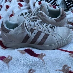 Size 9 tan and brown adidas.